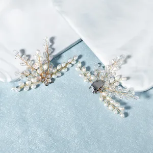 Detail view of pearl crystal bridal shoe clips, detachable rhinestone shoe flower decorations.