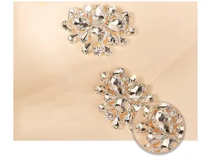 Closeup detail view of sparkling teardrop rhinestone shoe buckle bridal wedding accessory.