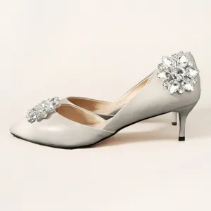 Elegant silver pointed toe kitten heels with sparkling crystal flower rhinestone shoe clips.