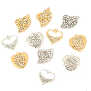 Close-up details of heart rhinestone charms, alloy metal pendant accessories for DIY jewelry.