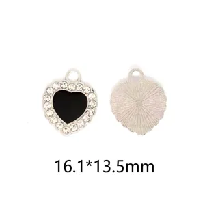 Detailed view of heart shaped alloy rhinestone diy charm pendant with black oil drop design.
