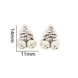 Detail shot of silver cherry alloy charms, perfect for DIY jewelry making and pendants.