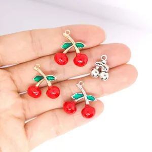 Detailed view of cute 3D red cherry enamel alloy charms, perfect for DIY jewelry making.