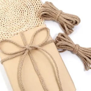 Detailed shot of thickened 8-strand natural jute rope, ideal for DIY crafts and home decor.