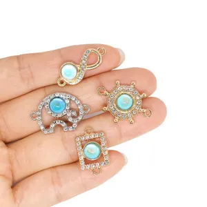 Close-up detail of alloy rhinestone and blue opal DIY jewelry charms, perfect for bracelets.
