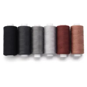 Detailed view of colorful polyester sewing threads in neat spools, ideal for DIY crafts.