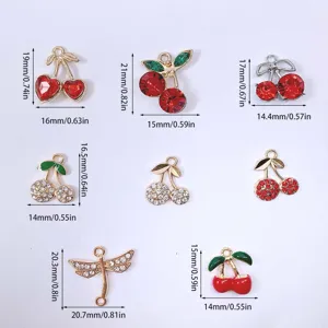 Detail view of alloy zircon cherry charms and dragonfly pendants for DIY jewelry making.