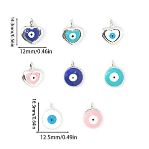 Detail view of evil eye alloy charms, multi-color drop oil pendants for DIY jewelry making.