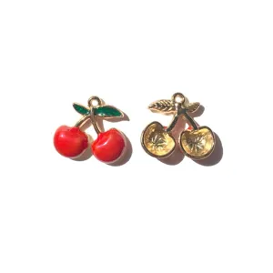 Cherry pendant detail view showing front enamel color and back hollow metal texture.