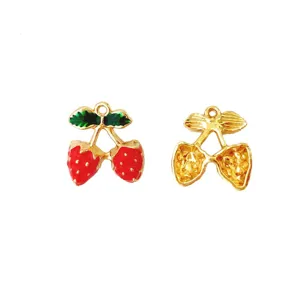 Gold alloy cherry charm pendant with red and green enamel, perfect for DIY jewelry making.