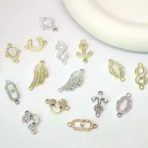 Details of DIY double loop rhinestone jewelry charms, gold and silver plated components.