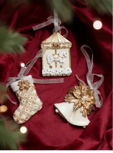 Christmas tree hanging ornaments set, white and gold resin carousel stocking bell decor details.