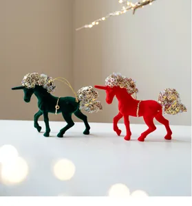 Christmas velvet unicorn ornament detail with sparkling sequins and festive hanging string.