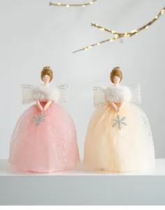 Charming Christmas tree top angel doll detail, pink and beige lace skirt holiday decor.