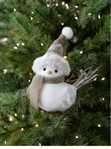 Detailed view of creative Christmas foam bird ornament with knitted hat for tree decor.