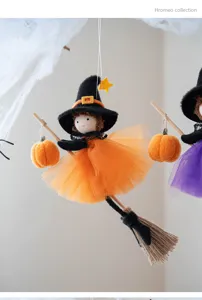 Close up of Halloween witch hanging decor, featuring cute fabric doll, tulle skirt and broom.