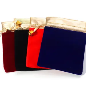 Velvet drawstring jewelry pouches with gold trim set for gift wrapping and small accessories.