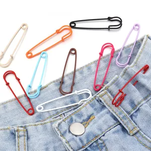 Colorful metal safety pins detailed view, ideal for DIY clothing decoration and waist adjustment.