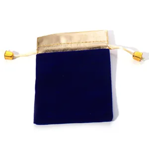 Blue velvet jewelry pouch with gold metallic trim and drawstring design for small gifts.