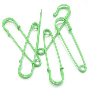 Green metal safety pins set for clothing waist tightening, DIY craft and brooch accessories.