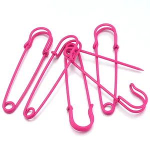 Close-up of pink metal safety pins, ideal for DIY crafts, brooches, and clothing adjustments.