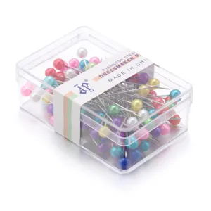 Spilli da sarta in acciaio inossidabile colorato con scatola di immagazzinaggio trasparente.