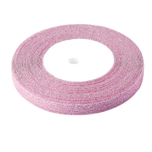 Detailed shot of pink metallic glitter ribbon roll, ideal for handmade DIY crafts and gift wrapping.