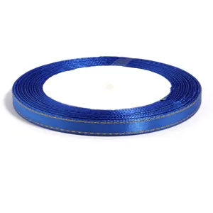 Detailed view of the blue satin ribbon with gold stitched edges, showing texture and close-up finish.