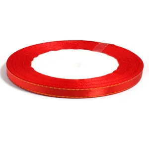 Polyester gold-edged red ribbon roll for gift box packaging, DIY crafts, and hair bows.