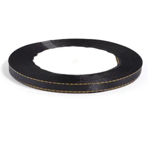 Black polyester ribbon with gold stitching, great for gift packaging and DIY crafts.