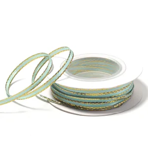 Light blue gold edge polyester ribbon roll for gift box packaging and DIY craft bows.