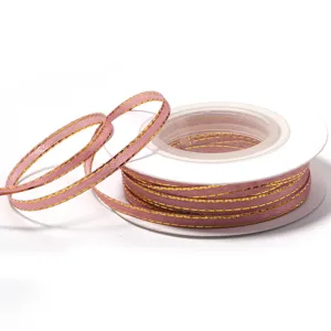 Polyester gold edge ribbon detail for gift box packaging and handmade DIY crafts accessories.