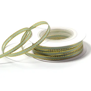 Green polyester ribbon with gold edge for gift wrapping, DIY crafts, and bows.