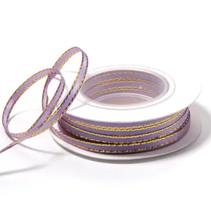 Purple gold-edge polyester ribbon roll for gift box packaging, DIY crafts and apparel accessories.