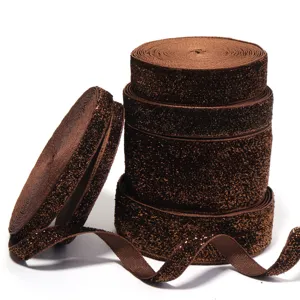 Brown glitter velvet ribbon rolls for DIY clothing, gift box packaging, and party decoration crafts.