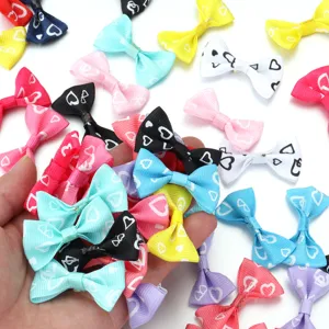 Close-up of colorful ribbon heart print bows, perfect for DIY hair clips and craft accessories.