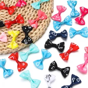 Ribbon bow detail shot showcasing cute heart print craft accessories for DIY apparel and hair.