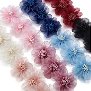 Detailed close-up of multi-color 5cm organza flower patches for DIY apparel and accessories.