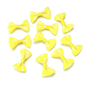 Yellow grosgrain ribbon bows with heart print, DIY handmade hair accessories and apparel decor.