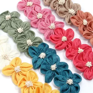 Handmade imitation linen fabric five-petal flowers with stamens for DIY crafts and accessories.