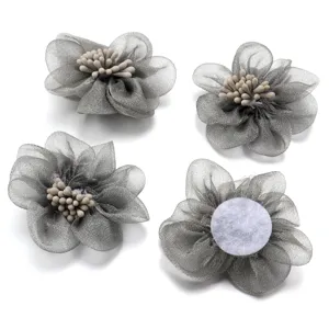 Detailed view of grey organza flower accessories with stamens, perfect for DIY crafts and decor.