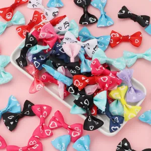 Colorful ribbon bows with heart print for DIY hair accessories, clothing, and crafts decoration.