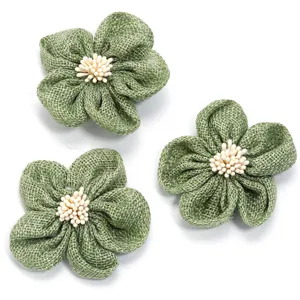 Green faux burlap fabric five petal flower detail for DIY hair accessories and clothing.