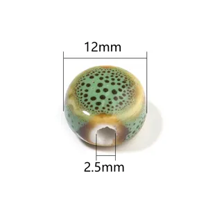 Perline tonde piatte con foro grande in ceramica smaltata per creazione gioielli fai da te.
