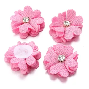 Pink rhinestone fabric flower details, DIY hair accessories material close-up shot.