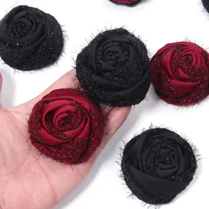 Closeup of velvet mesh rose flower patch, sparkly thread floral accessory for DIY crafts.