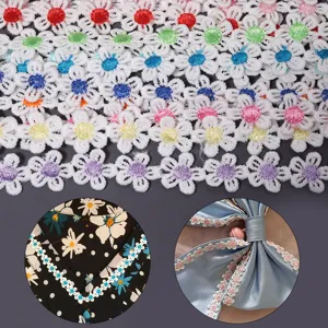 Detailed view of polyester color water-soluble embroidered daisy lace trim for DIY crafts.