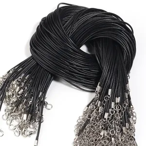 Close up detail of black wax cord necklace with silver lobster clasp for DIY jewelry making.