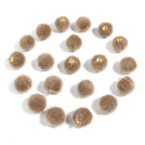 Faux fur pom pom charms with gold loops for DIY jewelry, keychains and clothing accessories.