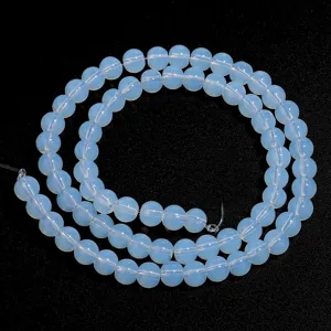 Detailed view of synthetic opal round loose beads, perfect for DIY jewelry making and crafting.